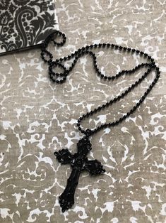 "Hand made gothic black cross pendant necklace Choice of smooth black cord necklace or ball chain necklace Corded necklace is 16\" long and hangs down from neck approx 9.5\" Ball chain necklace is 22\" long and hangs down approx 12\" from neck" Gothic Cross Pendant, Cross Necklace Goth, Goth Cross Necklace, Goth Necklaces, Cross Necklace Black, Gothic Cross Necklace, Long Cross Necklace, Black Crystal Necklace, Goth Cross