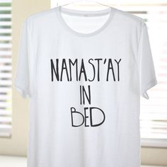 Namast'ay In Bed Namaste In Bed Namast'ay In Bed by ArimaDesigns Graphic Print Sleep Tops With Crew Neck, Graphic Print Crew Neck Top For Sleep, Crew Neck Sleep Top With Graphic Print, White Crew Neck Top For Relaxation, Relaxation Graphic Print Crew Neck Top, Graphic Print Crew Neck Tops For Relaxation, Crew Neck Top With Graphic Print For Relaxation, Yoga Tops With Letter Print And Crew Neck, White Graphic Print Sleep T-shirt