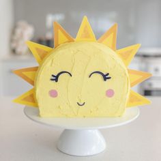 a cake decorated to look like a sun with eyes