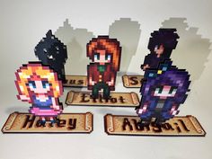 an image of some pixelated characters on the table with their name spelled in blocks