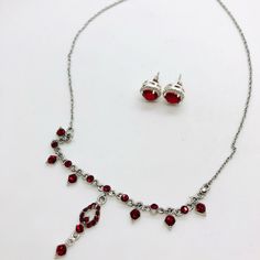 Vintage Modern Ruby Red Rhinestone Necklace & Earrings. Silver Tone. Swarovski Crystal Ruby Rhinestones Both Are Unsigned. Brand New Hypoallergenic Silver 925 Backings Have Been Added And Earrings Will Arrive Cleaned And Ready To Wear. Start A Bundle To Save On Shipping. Red Crystal Jewelry With Matching Earrings, Red Sterling Silver Party Jewelry Sets, Red Sterling Silver Jewelry Sets For Party, Red Crystal Jewelry Sets For Valentine's Day, Red Ruby Jewelry Sets With Matching Earrings, Red Rhinestone Jewelry Sets As Gift, Red Rhinestone Jewelry Sets For Gifts, Red Rhinestones Jewelry Sets For Party, Elegant Red Jewelry Sets With Sparkling Stones