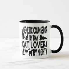 a black and white coffee mug that says public defender by day cat lover by night