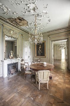 an image of a dining room with chandelier and fireplace in the center is instagramted