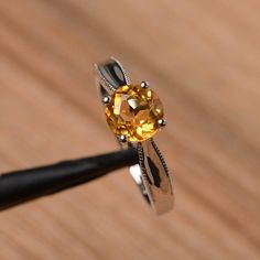 It is a natural citrine ring. The main stone is 7mm*7mm round cut, weight about 1.25 carats.The basic metal is sterling silver and plated with rhodium.To change the metal to a solid gold (white/rose) or platinum is also available, please ask for a quotation if you want.You can also go to my shop Home for more elegant rings: https://www.etsy.com/shop/godjewelry?ref=hdr_shop_menuMore citrine rings: https://www.etsy.com/shop/godjewelry?ref=seller-platform-mcnav&section_id=20715039Customization Citrine Rings, Round Cut Solitaire Engagement Ring, Elegant Rings, Sunflower Ring, Alexandrite Engagement Ring, Engagement Ring For Women, Alexandrite Ring, London Blue Topaz Ring, Citrine Ring