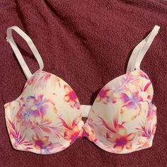 Brand New Victoria’s Secret Pushup T Shirt Bra In A Light Colorful Watercolor Print Lined In Hot Pink. Has Only Been Tried On Once, In Brand New Condition. Has Two/Hook:Eyes In The Back And Padded Straps. Size 32d Casual White Bra, Multicolor Push-up Bra For Summer, White Push-up Swimwear For Beach, Floral Print Underwire Bra For Beach, White Underwire Summer Top, Spring Beach Push-up Bra, White Underwire Top For Summer, Floral Print Underwire Bra, Summer Beach Bra With Floral Print