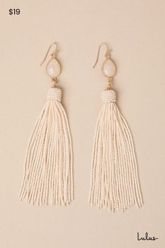 Elevate all your summer looks with the Lulus Enviable Design Beige Tassel Earrings! These stunning earrings are composed of gold-toned metal and have teardrop-shaped stone-like pendants supporting oversized, boho-chic tassels formed from long strands of seed beads. Fishhook backs. 5" Long. 70% Glass, 20% Iron, 10% Resin. Imported. Lulus | Enviable Design Beige Tassel Earrings. Elegant Gold Tassel Earrings For Beach, Elegant Beach Earrings With Latkans, Elegant Latkans Earrings For Beach, Elegant Tassel Teardrop Earrings, Elegant Teardrop Tassel Earrings, Beige Teardrop Bohemian Jewelry, Elegant Teardrop Beaded Earrings For Beach, Bohemian Beige Teardrop Jewelry, Beige Bohemian Teardrop Jewelry