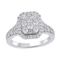 a white gold ring with diamonds on the sides and an oval shaped center surrounded by smaller round