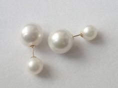 This is a pair of double-sided earrings made of 12-13mm white Edison pearls and 8-8.5mm white freshwater pearls set on solid 18K yellow gold posts. The pearls are perfectly round, have a rare and becutiful natural color, excellent luster and thick nacre with almost no blemishes on the skin.  An absolutely must-have addition to your pearl jewelry collection.! All metal components are solid 14K solid gold! Packged with a lovely jewelry box. Thank you for shopping at my shop Double Sided Pearl Earrings, Black Freshwater Pearls, Double Sided Earrings, Edison Pearls, Purple Pearl, Earring Post, Freshwater Pearls Earrings, White Freshwater Pearl, Pearl Set