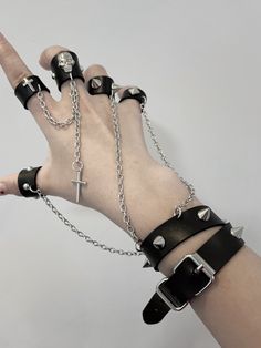 This uniquely designed bracelet features an integrated ring, connected by a stylish chain that adds a touch of avant-garde elegance. The bracelet is adorned with stud embellishments, while the ring showcases intricate decorations including skeleton motifs, crosses, and additional studs.  Please note that the price includes one bracelet with rings.  Ring Diameters: - Thumb, Index, and Middle Fingers: 6.5 cm - Ring and Pinky Fingers: 6 cm Kawaii Leg Warmers, Punk Skirt, Pastel Punk, Kawaii Sweatshirt, Gothic Bag, Middle Fingers, Heart Shaped Bag, Cross Choker, Gothic Shoes