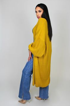 You'll always find yourself reaching for this Oversized Longline Cardigan. It's the perfect transitional piece, with an open front and pockets. It is meant to have a chunky, oversized, and relaxed fit for an effortlessly chic look with maximum comfort. Throw it on over your easy looks and let this cardigan do the work. One Size Fits US Small - XL Material: 100% AcrylicStretch: Does have stretchFit: Oversized fit.Model size: Style is One Size Fits most. Kalani normally wears a medium. Oversized Open Front Solid Sweater Coat, Trendy Oversized Open Front Sweater, Trendy Oversized Yellow Outerwear, Trendy Oversized Solid Cardigan, Yellow Relaxed Fit Outerwear For Fall, Yellow Long Cardigan For Fall, Long Yellow Fall Cardigan, Mustard Oversized Outerwear For Spring, Oversized Yellow Chunky Knit Sweater