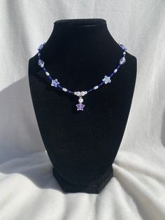 Dark blue with a hint of purple necklace. Perfect for a star and space lover. Purple Star Necklace, Blue Star-shaped Beaded Necklace, Celestial Blue Beaded Necklaces, Handmade Blue Star-shaped Beaded Necklaces, Handmade Blue Star Beaded Necklaces, Handmade Blue Beaded Star Necklaces, Blue Star-shaped Adjustable Necklace, Celestial Blue Star-shaped Jewelry, Blue Star-shaped Celestial Jewelry