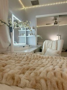 a bedroom with white furniture and lights on the ceiling is pictured in this image, it appears to be very cozy