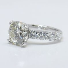 an oval cut diamond ring with side stones