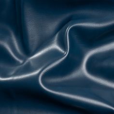 an image of a blue leather texture that is very soft and smooth to the touch