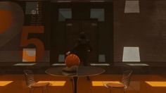 a room with two chairs, a table and a basketball on the floor in front of it