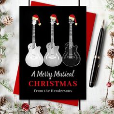 a christmas card with three guitars on it