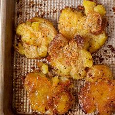 some food that is sitting on a baking sheet in a pan and ready to be cooked