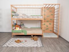 a bunk bed with two sets of drawers and a rug on the floor next to it