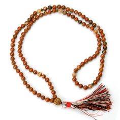 Jasper and Rudraksha 8mm Knotted Mala with Silk Tassel Approx 44" long including 3 1/4" tassel. Strung and knotted on silk cord Bead size : 8mm Adjustable Spiritual Tassel Necklaces, Spiritual Tassel Necklaces With Adjustable Fit, Gift Brown Hand Knotted Mala, Brown Hand Knotted Mala As Gift, Brown Hand-knotted Mala As Gift, Adjustable Hand Knotted Mala For Meditation, Traditional Adjustable Hand Knotted Mala, Traditional Adjustable Hand-knotted Mala, Brown Hand Knotted Mala With Round Beads