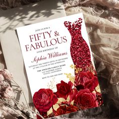 an elegant wedding card with red roses and sequins on the dress is displayed