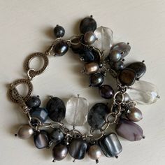 Such A Fun Bracelet With Silpada Sterling Silver Circular Charms Mixed With Gray Pearls, Shell, Glass, Hematite. New Never Worn! Goes With Black Jeans, Leggings, Dresses, Casual Or Dressy! 8 Inches Long But Has Toggle Clasp So It Can Be Worn At 7 Or 8 Inches Silver Fusion Beaded Bracelets With Natural Stones, Silver Beaded Bracelet With Natural Stones And Dangle, Silver Beaded Bracelets With Natural Stones And Dangle, Silver Fusion Bracelets With Natural Stones, Fun Bracelet, Silpada Jewelry, Jeans Leggings, Pearl Grey, Toggle Clasp