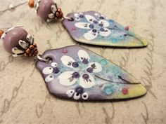 Purple Hand Painted Bohemian Earrings, Bohemian Hand Painted Purple Earrings, Artistic Hand-painted Purple Earrings, Unique Hand Painted Purple Earrings, Artistic Purple Earrings For Gift, Artistic Flower-shaped Jewelry For Crafting, Artsy Purple Drop Earrings, Handmade Artsy Purple Jewelry, Artsy Handmade Purple Jewelry