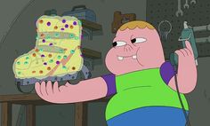 a cartoon character holding a cake in his hand