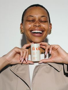 a woman holding a coffee mug in her hands