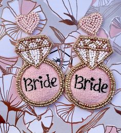 These fun earrings are the perfect accessory for you and your Bride Team! They are crafted with seed beads and feature a heart-shaped post. Gift wrap and personalized card are available! Beaded Dangle Earrings For Wedding, Beaded Dangle Bridal Earrings For Wedding, Bridal Beaded Dangle Earrings For Wedding, Handmade Pink Beaded Earrings For Wedding, Pink Beaded Drop Earrings For Wedding, Pink Beaded Earrings For Weddings, Handmade Bridal Earrings For Party, Handmade Round Bridal Earrings For Party, Valentine's Day Gold Beaded Earrings For Party