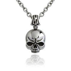 Carry a symbol of life's impermanence with the Ember Skull Necklace. This striking piece features a finely sculpted stainless steel skull that hangs with a quiet assertion of presence. Suspended on a durable chain, it’s an emblem of resilience and serves as a reminder to make every moment count. Gothic Skull Necklace In Stainless Steel, Skull Shaped Stainless Steel Necklace Gift, Nickel-free Stainless Steel Skull Necklace, Silver Stainless Steel Jewelry With Skull Print, Skull-shaped Engraved Stainless Steel Necklace, Skull Shaped Engraved Stainless Steel Necklace, Engraved Skull Necklace In Stainless Steel, Gothic Oxidized Stainless Steel Necklaces, Gothic Stainless Steel Necklace With Oxidized Finish