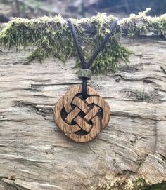 "This very unique Celtic knot necklace will be hand-carved for you, or a loved one, in my studio on the West of Ireland. This intricate wooden pendant features a piece of Irish Chestnut, recycled from musical instruments constructed by a local luthier. As a musician myself, I take enormous satisfaction in creating a necklace whose inherent wood has previously featured in a beautiful hand-made harp. The Celtic knots date back to the 3rd to 4th century B.C. Drawn in one continuous line, suggesting Rustic Wooden Beads Necklace As Gift, Rustic Wooden Bead Necklaces For Gifts, Rustic Wooden Beads Necklace For Gift, Celtic Wood, Adjustable Carved Nature-inspired Necklaces, Rope Braided Wood Carved Mjonir Necklace, Brown Carved Round Pendant Necklace, Rustic Natural Wood Necklace, Carved Natural Wood Necklaces