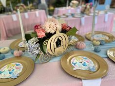 the table is set with plates, napkins and place settings for guests to eat