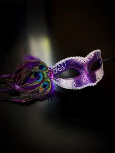 Delicate glitter accents enhance the allure of the mask, catching the light for a subtle yet glamorous effect. Adorned with peacock feathers, the mask exudes a sense of natural beauty and sophistication, making it a standout accessory at any masquerade event!


Age Group/Gender - Adult/Women

Size/Type - One size fits all adults

Mask Color - Silver/Purple

Mask Material - Polyresin

Accent Material - Feathers Masquerade Event, Peacock Mask, Kids Party Packs, Masquerade Mask Women, Feather Peacock, Purple Mask, Feather Mask, Peacock Colors, Female Mask