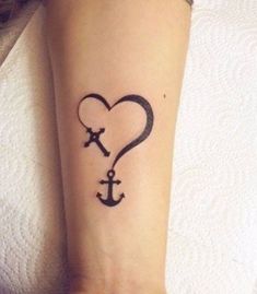 an anchor and heart tattoo on the wrist