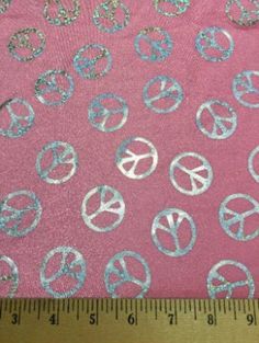 a pink fabric with peace signs on it