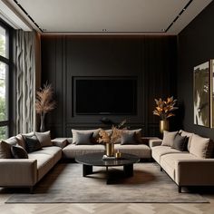 Discover a sophisticated living room design featuring a harmonious blend of black, brown, and gold elements. This space showcases plush beige sofas accented with black cushions, a sleek black coffee table, and gold decorative vases. The dark walls and natural light create a cozy yet luxurious atmosphere, perfect for modern home decor enthusiasts seeking black brown and gold living room ideas. Gold Living Room Ideas, Beige Sofas, Room Design Inspiration, Black Coffee Table, Gold Living, Living Room Design Inspiration, Decorative Vases, Black Coffee Tables