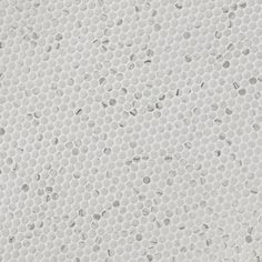 the texture of white paper with holes in it