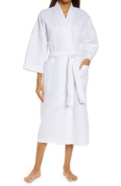 A soft waffle weave and bell sleeves define this plush longline robe that was made for lounging. 48" length True wrap style with tie closure Shawl collar Three-quarter sleeves Unlined 60% cotton, 40% polyester Machine wash, tumble dry Imported Women's Clothing White Tie Waist Long Sleeve Robe, Waffle Weave, Shawl Collar, Somerset, Three Quarter Sleeves, Long A Line, Wrap Style, Three Quarter, Waffles