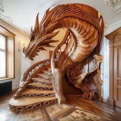 a spiral staircase made out of wood with intricate carvings on the top and bottom sides