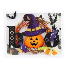 a halloween decoration with pumpkins and witch hats