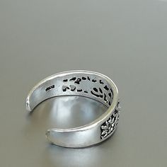 A filigreed Egyptian style silver toe band 6 mm wide. This is an open ended toe ring and can be adjusted to fit most feet. These toe rings are made of 925 hypoallergenic sterling silver. Please note this price is for ONE toe ring only. Can be sent in a gift box. I can include a personal message from you if needed You are welcome to contact me at... bhavnakwintra1956@gmail.com For more beautiful pieces from my shop, please browse 👇 TOE RINGS: https://www.etsy.com/your/shops/TheSilverGame/tools/l Silver Metal Open Toe Rings, Silver Open Ring Toe Rings, Silver Metal Toe Rings As Gift, Adjustable Silver Metal Toe Rings, Adjustable Stamped 925 Toe Ring, Silver Adjustable Toe Rings Stamped 925, Adjustable Silver Toe Rings Stamped 925, Handmade Silver Open Toe Ring, Silver Toe Rings Stamped 925 Open Ring