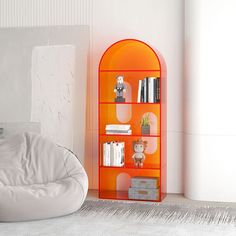 an orange book shelf sitting next to a white chair