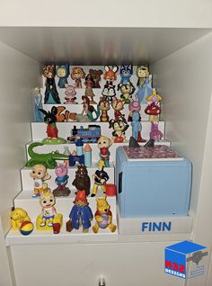 a bunch of figurines are sitting on top of a shelf