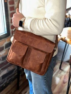 Timeless Elegance, Effortlessly Carried: - Full-grain vegetable-tanned leather: Hand-buffed for enduring quality and classic style. - Spacious main compartment: Fits laptops, notebooks, and everyday essentials. - Organized pockets: Stay effortlessly organized with interior zip, multifunction, and exterior pockets. - Secure magnetic closure: Keeps your belongings safe and accessible. - Adjustable strap: Comfortable crossbody or shoulder carrying (60-130cm). - Rich color options: Choose from Tobac Brown Leather Flap Briefcase, Brown Smooth Grain Rectangular Saddle Bag, Leather Case With Smooth Grain For Everyday Use, Leather Cases For Everyday Use, Leather Cases With Smooth Grain For Everyday Use, Travel Shoulder Bag With Smooth Grain In Saddle Shape, Cognac Leather Bag With Flap, Everyday Carry Soft Leather Briefcase, Rectangular Soft Leather Briefcase For Everyday Carry