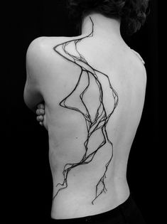 the back of a woman's body with lines drawn on it