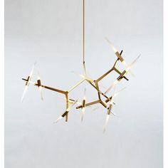 a modern chandelier hanging from a ceiling