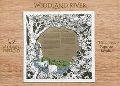 the wood and river papercut is on display