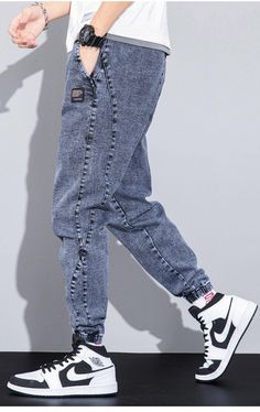 Casual Dark Wash Cargo Jeans, Trendy Cotton Cargo Jeans, Casual Dark Wash Pants With Side Pockets, Casual Tapered Leg Cargo Jeans For Streetwear, Casual Dark Wash Cargo Pants With Hip Pockets, Casual Cargo Style Jeans For Streetwear, Trendy Denim Pants With Elastic Waistband, Casual Medium Wash Tapered Cargo Jeans, Medium Wash Cotton Cargo Pants