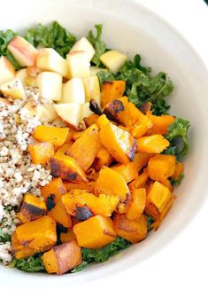 a white bowl filled with vegetables and rice