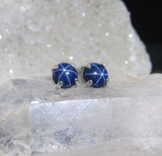 Silver options will still be processed in 1-3 days, but solid gold processing time is 2 days -3 weeks depending on the amount of orders. ------------------------------------------------------- THE PRODUCT These are completely natural navy blue star sapphire earrings. By the way they're formed in the ground a gorgeous iridescent star glows from within them as it catches light! This is a super rare stone and will be an eye catcher wherever you wear them. This natural star sapphire is the best qual Blue Sapphire Studs, Pandora Earrings, Aquamarine Studs, Tiffany Earrings, Blue Star Sapphire, Plastic Earrings, Sapphire Studs, Golden Earrings, Rare Stone